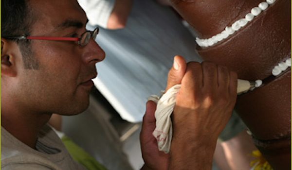 Albert Trevino decorating a cake