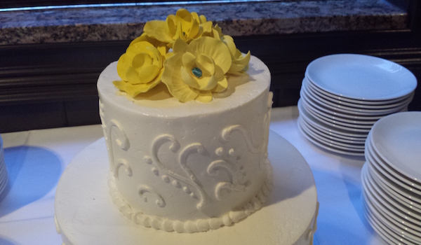 small cake with yellow flowers